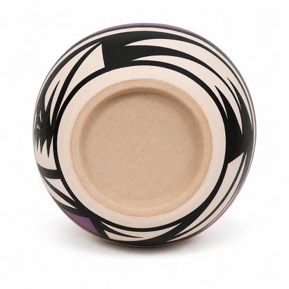 Ceramic bowl with black and white abstract design on a white background